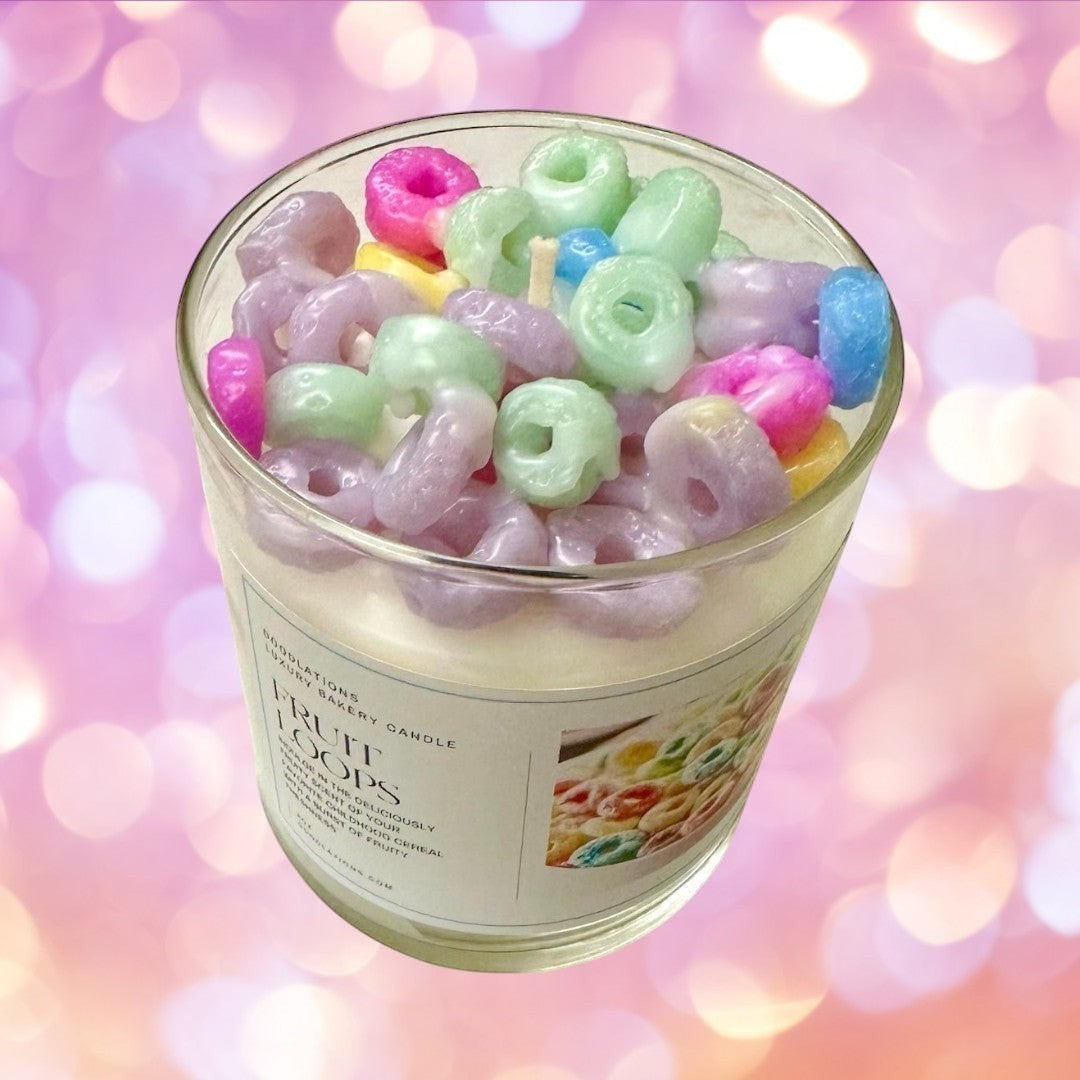 Fruit Loops luxury bakery candle in a glass jar, topped with colorful cereal pieces. Fruity scent.