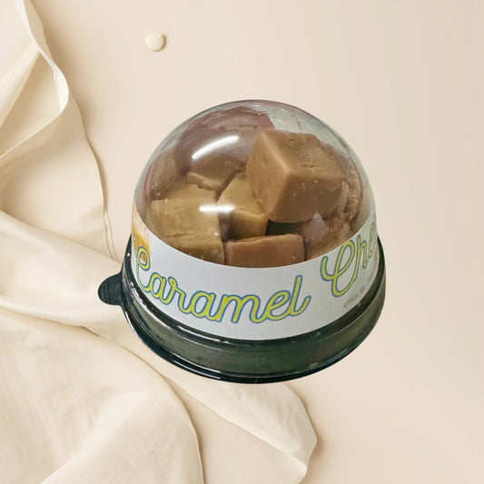 Caramel Chew wax melts in a clear plastic container with a white label.