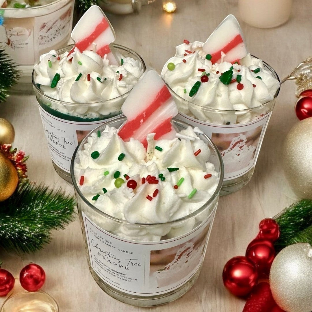 Christmas Tree Frappe candle with whipped wax topping, sprinkles, and candy cane accent.