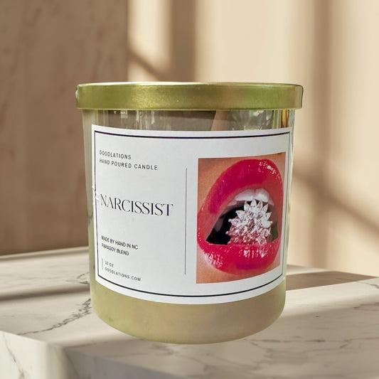 Doodlations Coffee Bar & Boutique Narcissist luxury hand-poured soy blend candle with a bold floral-fruity scent.