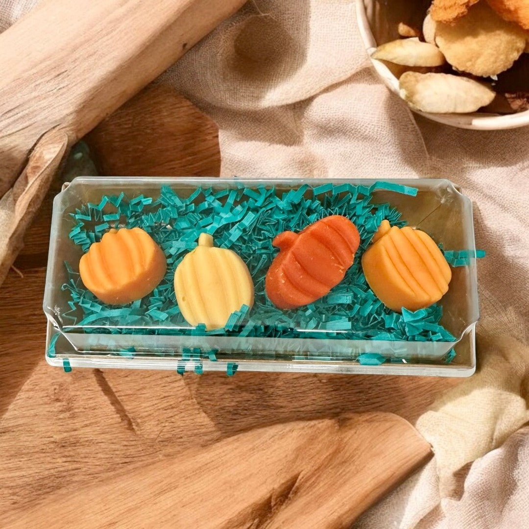 Smashed Pumpkin wax melts in pumpkin shapes, orange and yellow, with fall fragrance.