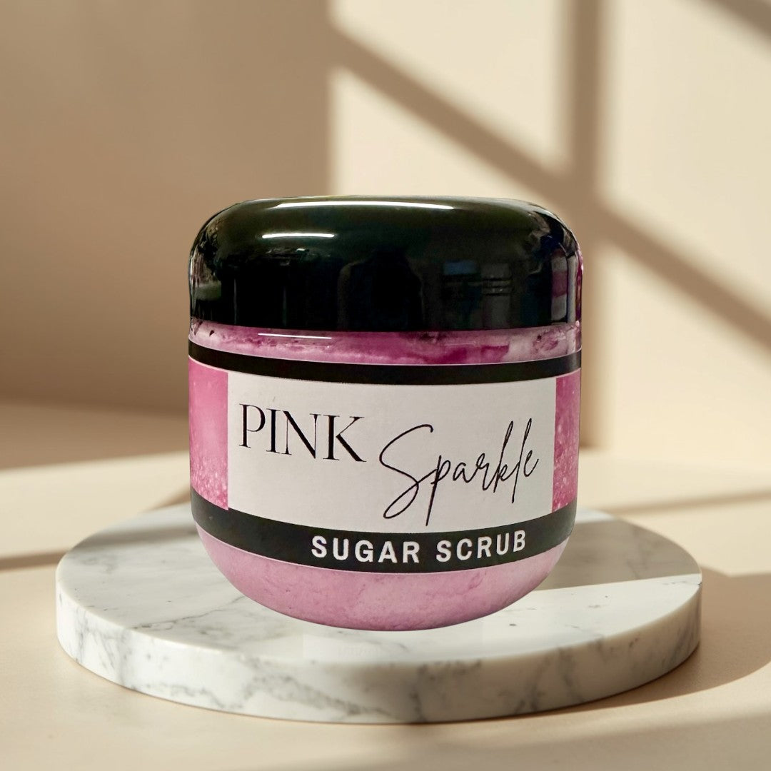 Pink Sparkle Sugar Scrub, a luxurious exfoliating body scrub with a sweet fruity fragrance.