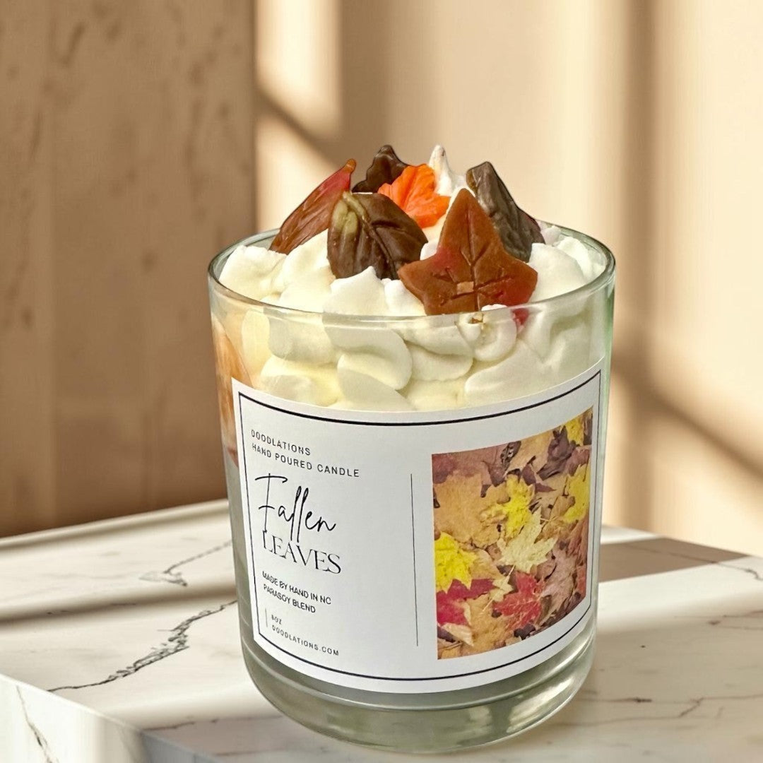 Doodlations Coffee Bar & Boutique Fallen Leaves hand-poured candle with realistic wax leaves and autumn scent.