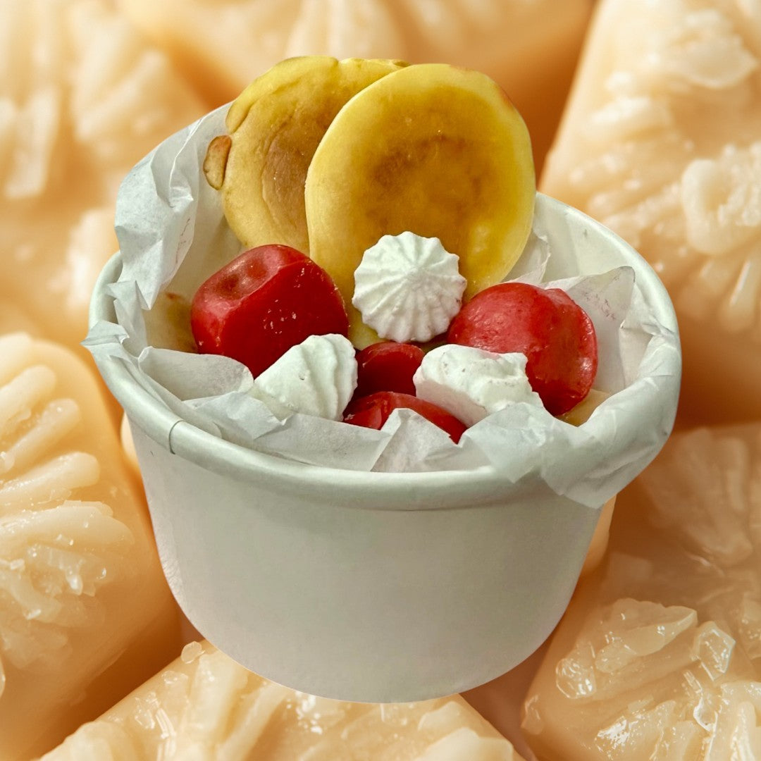 Cherry Pancake wax melts are shaped like pancakes, cherries, and meringues in a pink bowl.
