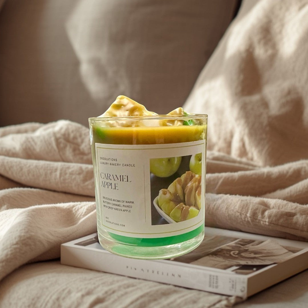 Apple Caramel Candle with green wax base and caramel-topped apple slices on label.