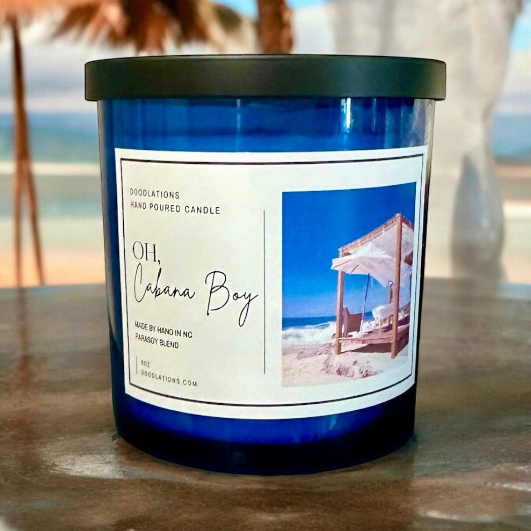 Oh Cabana Boy luxury hand-poured candle with tropical beach scene label.