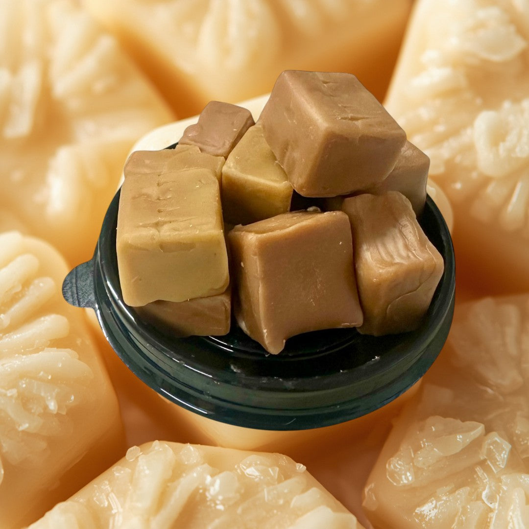 Caramel Chew wax melts in a clear plastic container with a white label.