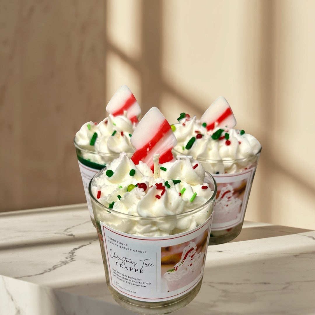 Christmas Tree Frappe candle with whipped wax topping, sprinkles, and candy cane accent.