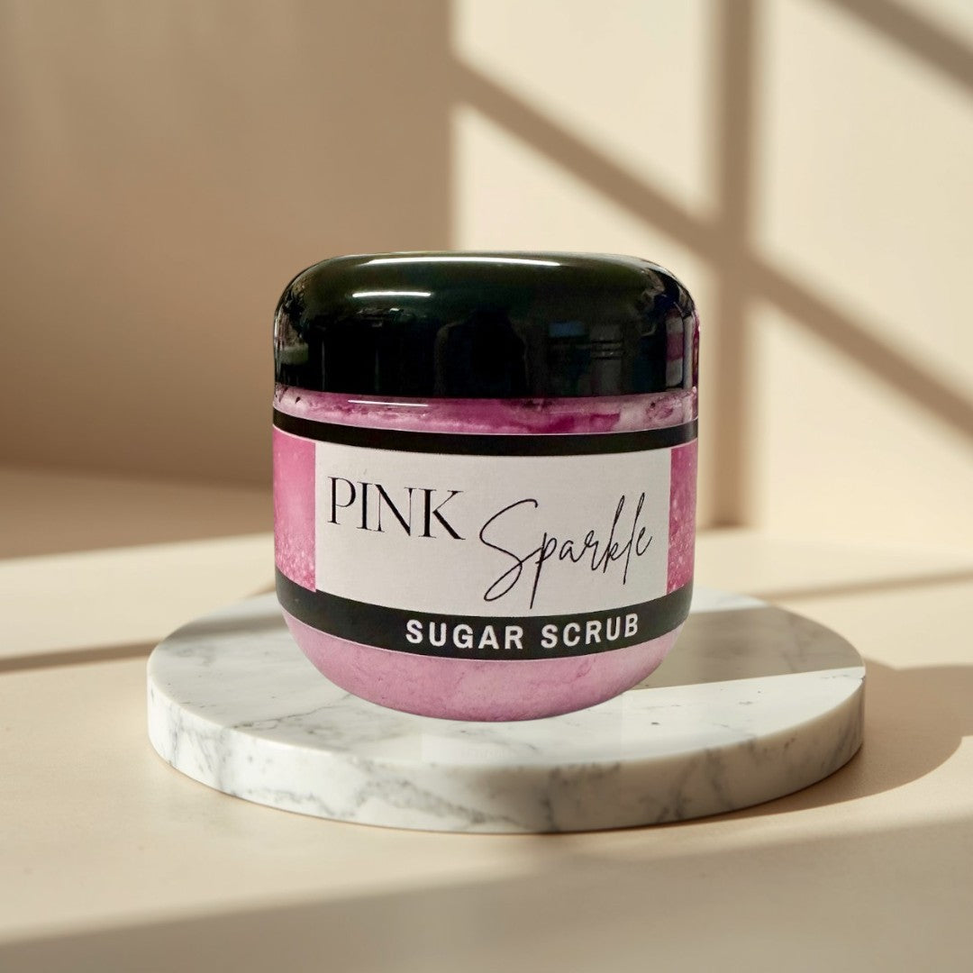 Pink Sparkle Sugar Scrub, a luxurious exfoliating body scrub with a sweet fruity fragrance.
