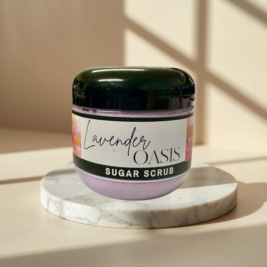 Lavender Oasis Sugar Scrub in a clear jar with a black lid. The scrub is lavender colored
