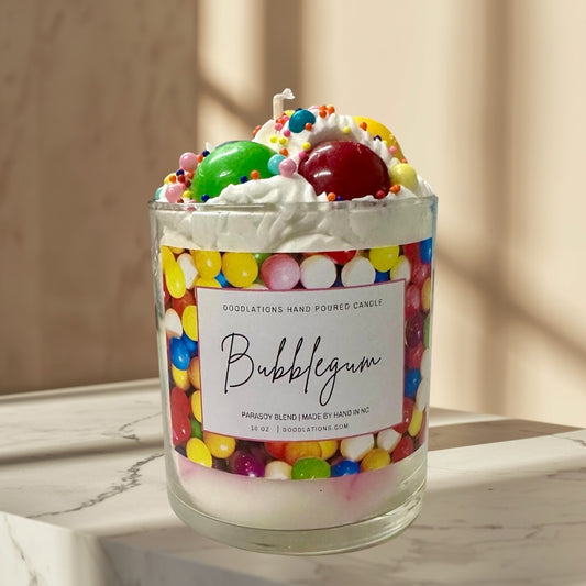Doodlations Coffee Bar & Boutique Bubblegum candle with whipped wax topping, candy sprinkles, and a colorful gumball wrapper design.