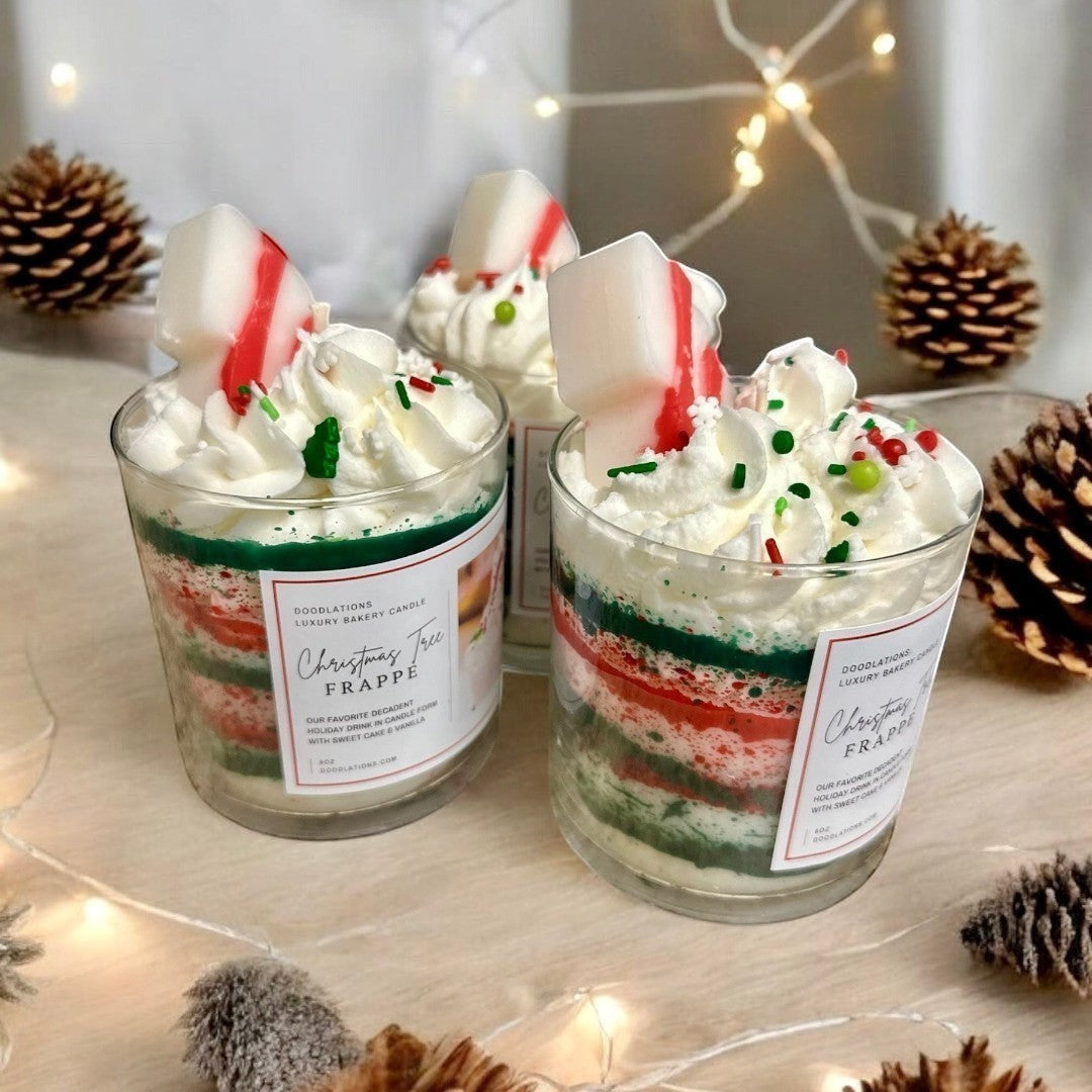 Christmas Tree Frappe candle with whipped wax topping, sprinkles, and candy cane accent.