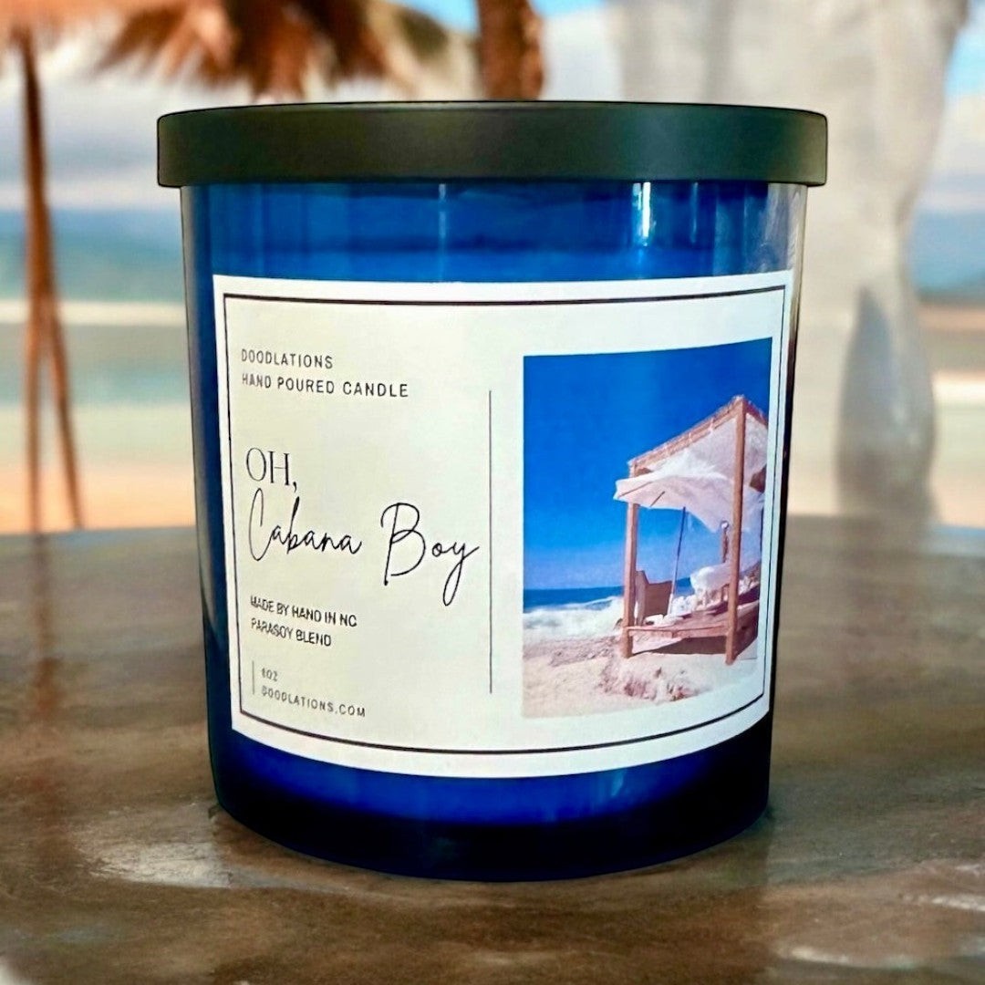 Oh Cabana Boy luxury hand-poured candle with tropical beach scene label.