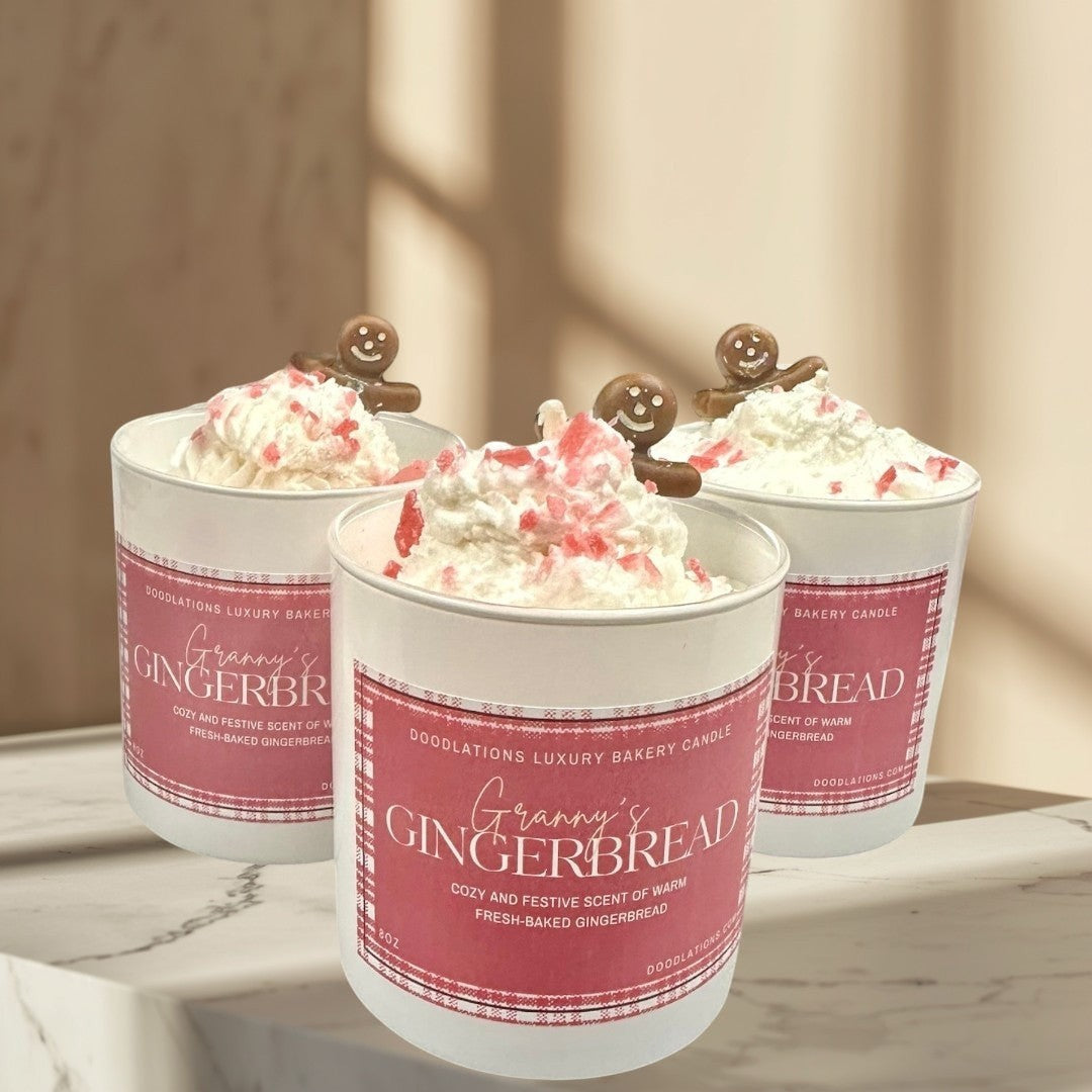 Christmas Gingerbread luxury bakery candle with whipped cream and gingerbread man topper.