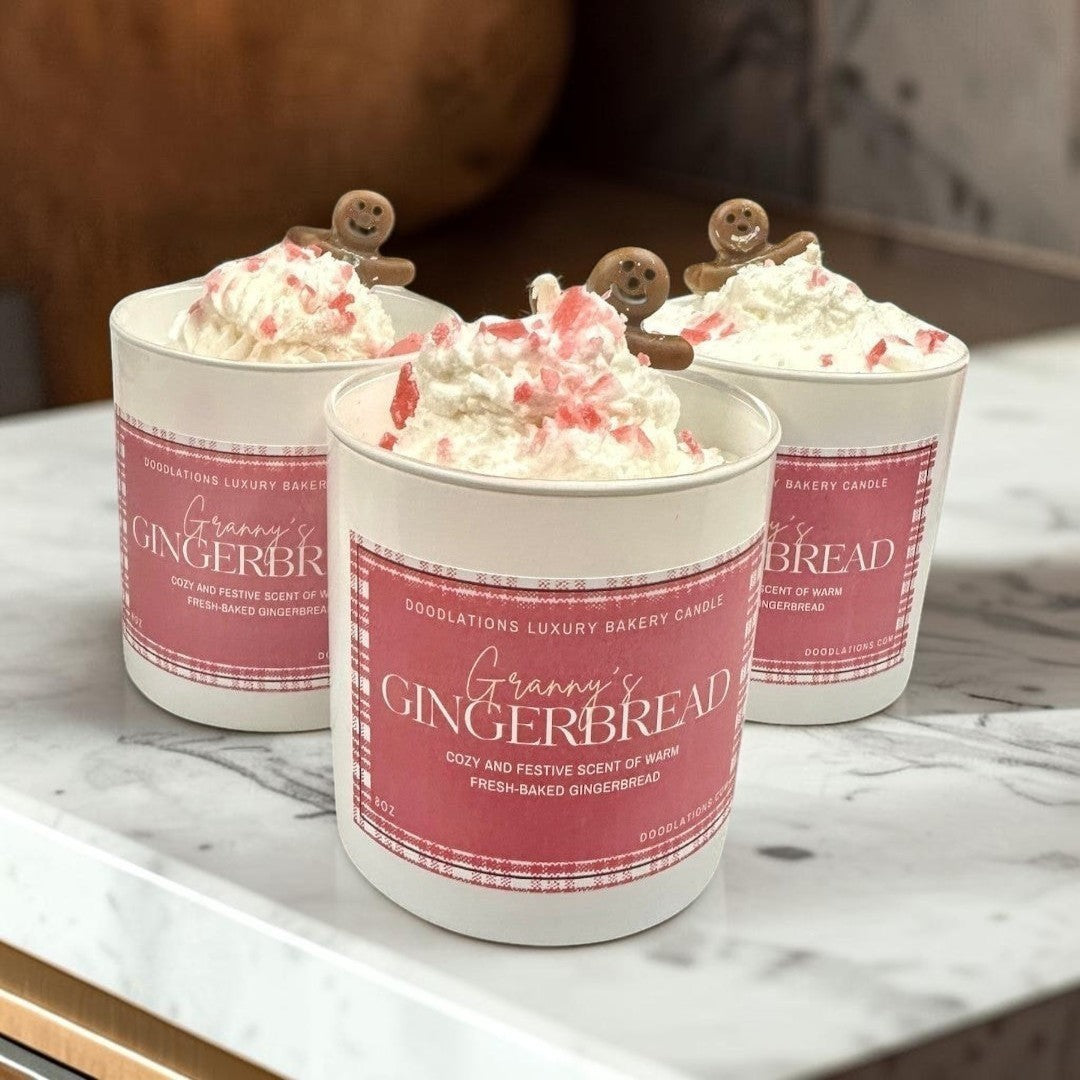 Christmas Gingerbread luxury bakery candle with whipped cream and gingerbread man topper.