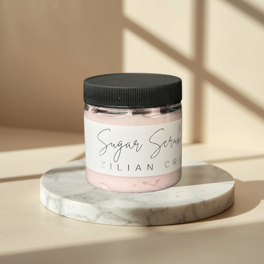 Brazil Crush sugar scrub in a clear jar with a black lid. Pink scrub inside.