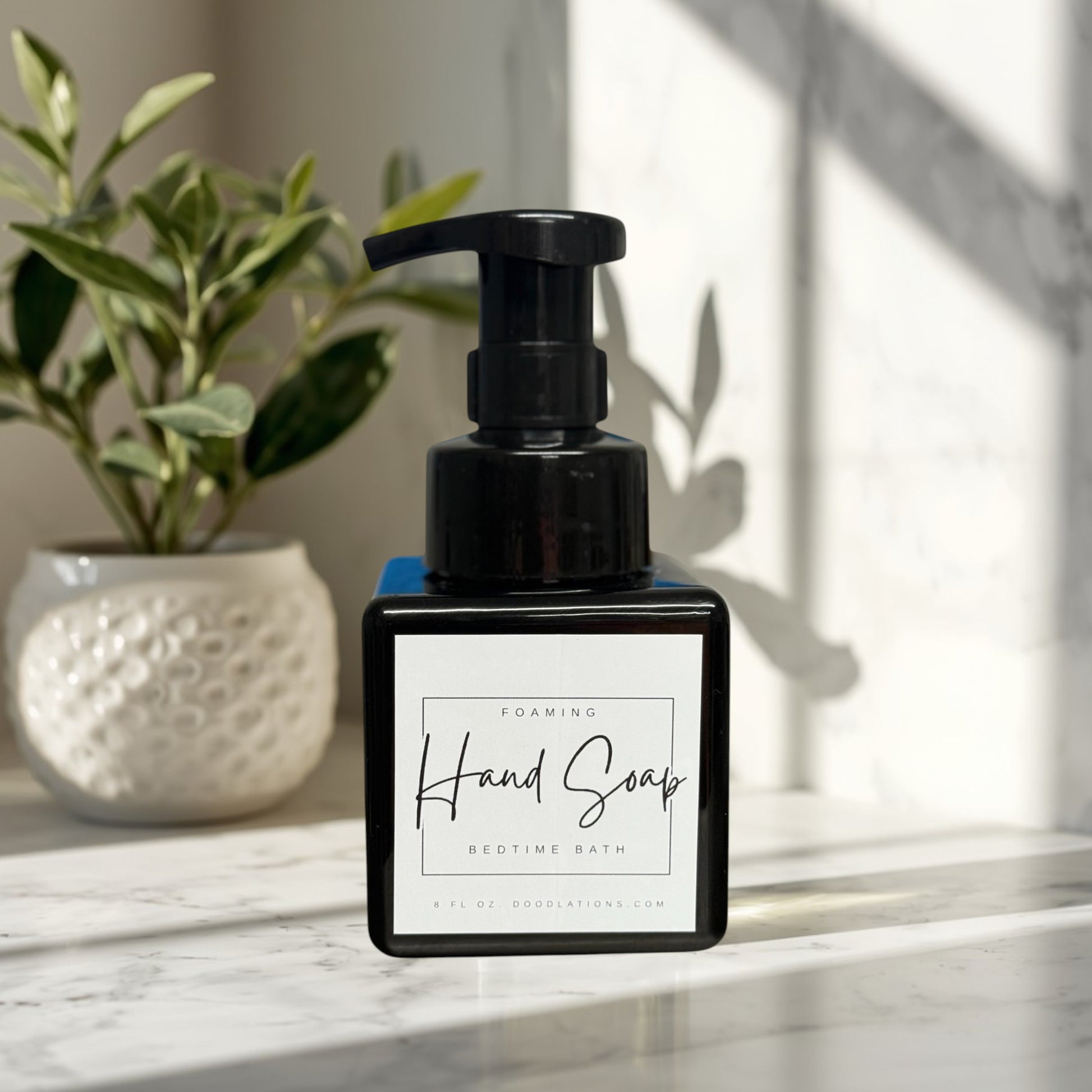Bedtime Bath foaming hand soap in a black square bottle with a white label.