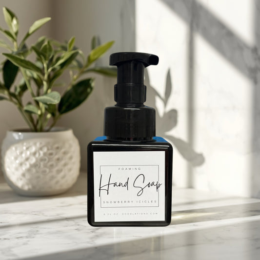 Snowberry Icicles foaming hand soap in a black pump bottle with a white label.