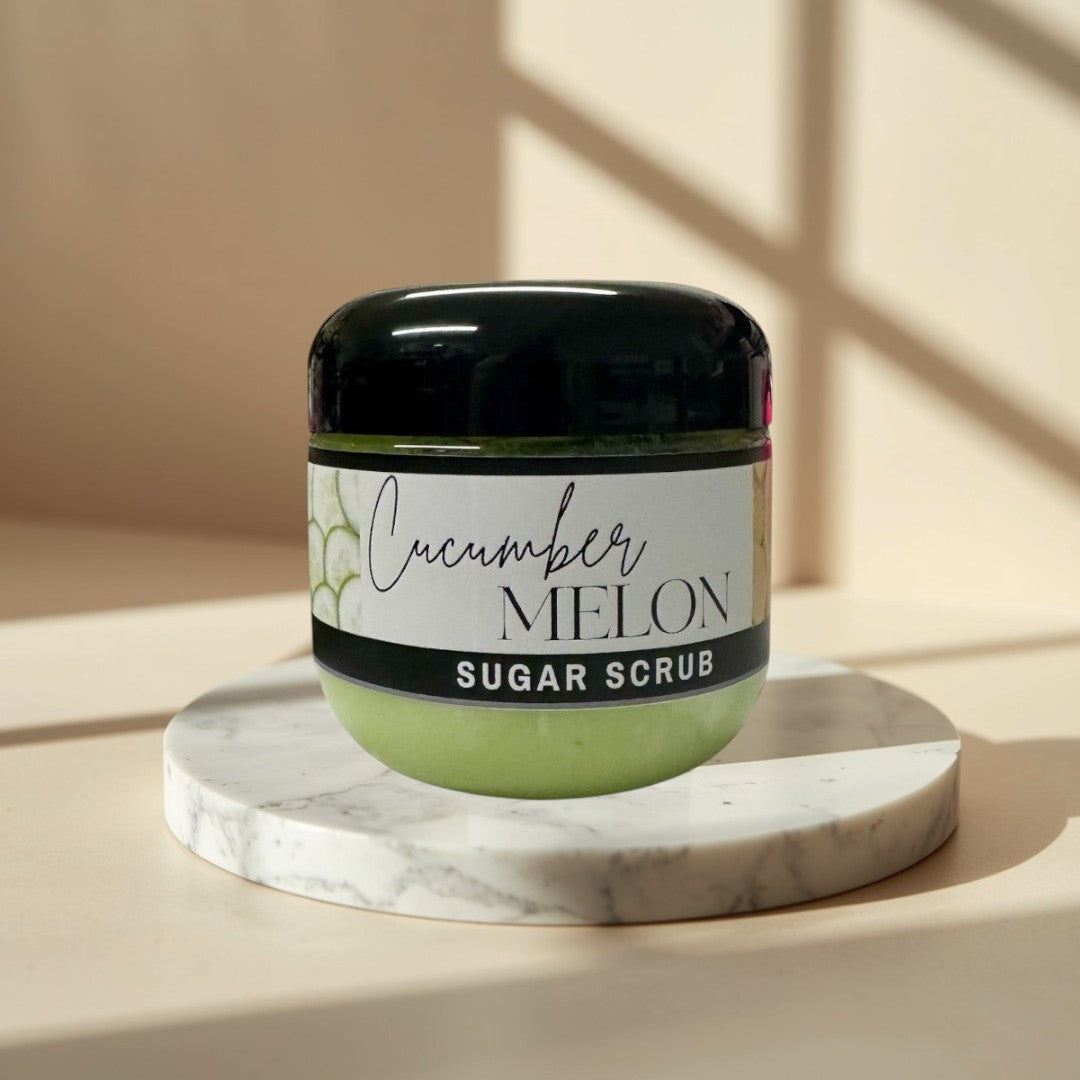 Cucumber Melon Sugar Scrub, 4 oz jar, light green exfoliating body scrub with black lid.
