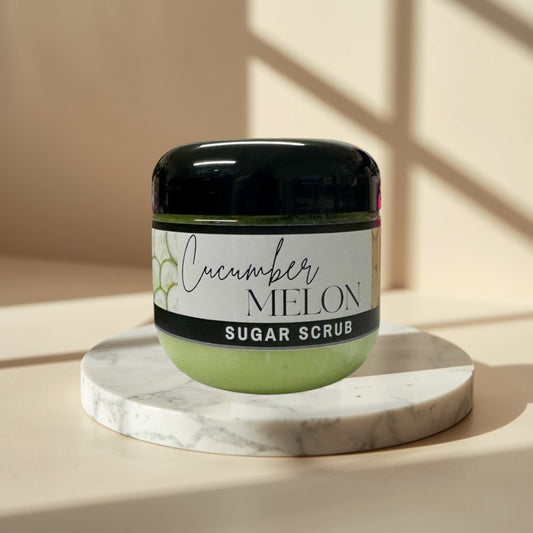 Cucumber Melon Sugar Scrub, 4 oz jar, light green exfoliating body scrub with black lid.