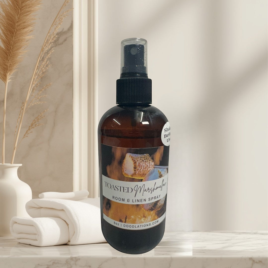 Toasted Marshmallow room and linen spray in amber bottle with black spray top.