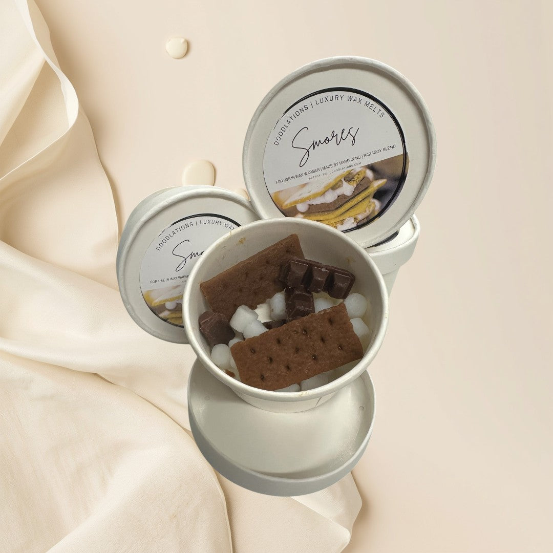 Smores wax melts shaped like graham crackers, chocolate bars, and marshmallows.