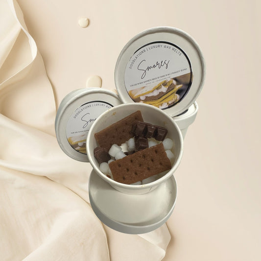 Smores wax melts shaped like graham crackers, chocolate bars, and marshmallows.