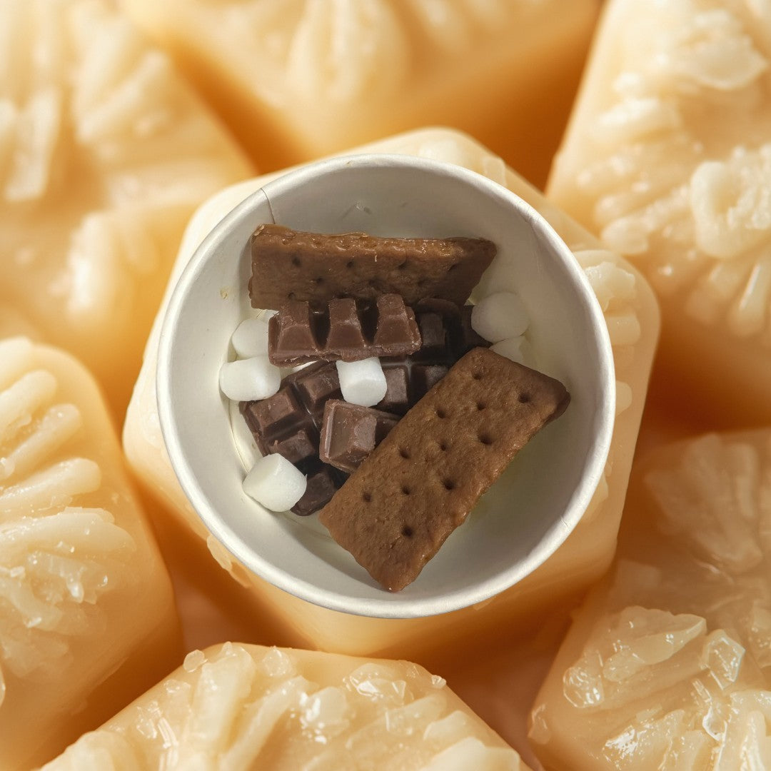 Smores wax melts shaped like graham crackers, chocolate bars, and marshmallows.
