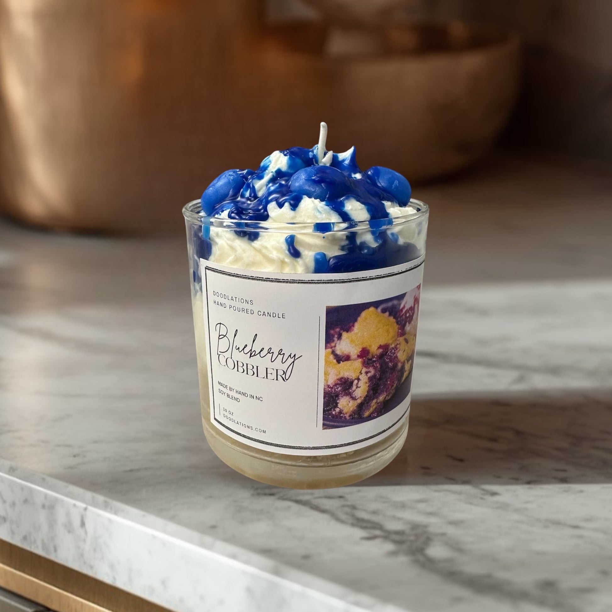Sweet blueberries, warm baked crust, and creamy vanilla blend together to create a delicious dessert-inspired fragrance with a cozy luxurious finish.

Bring a luxury boutique fragrance experience into your home with Doodlations.