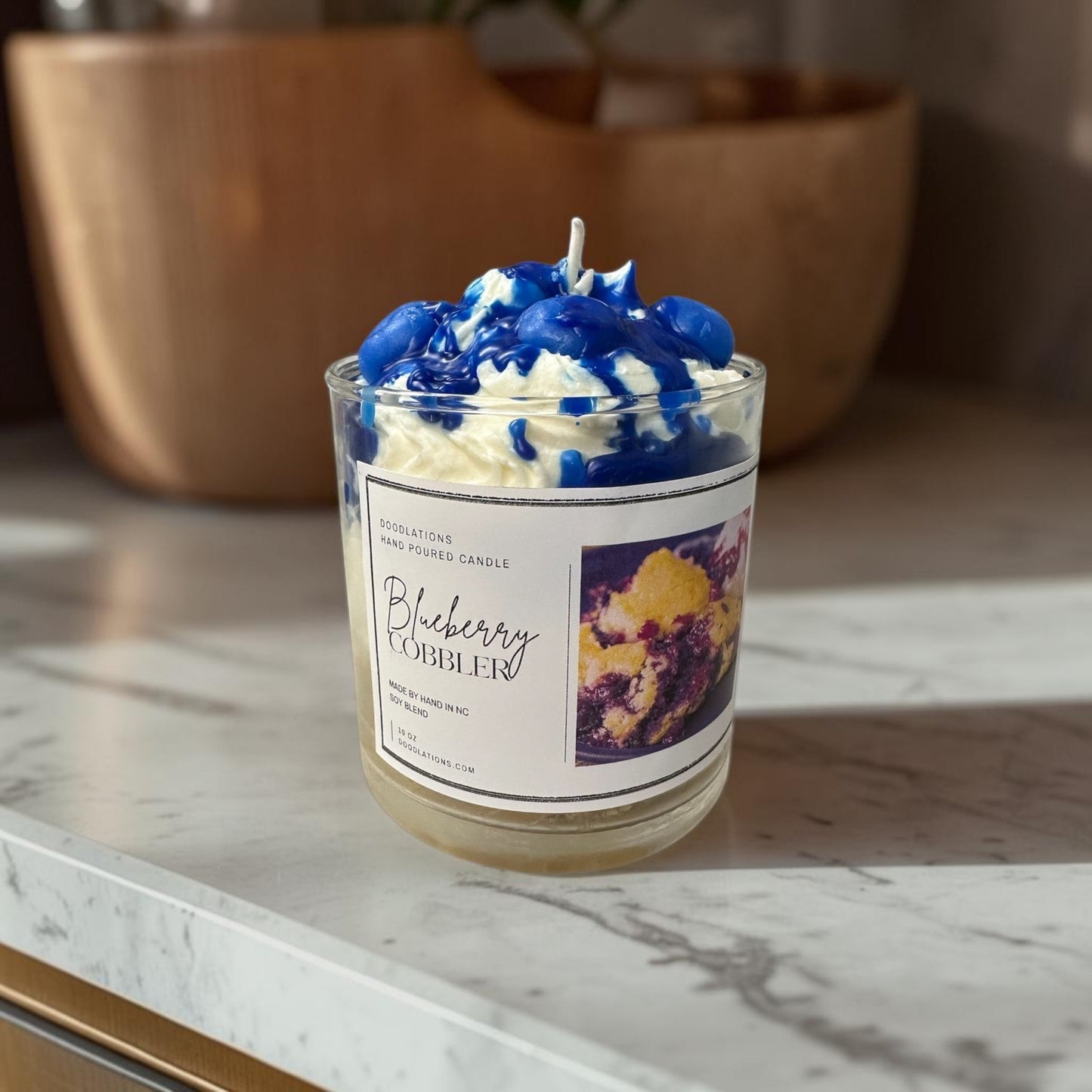 Sweet blueberries, warm baked crust, and creamy vanilla blend together to create a delicious dessert-inspired fragrance with a cozy luxurious finish.

Bring a luxury boutique fragrance experience into your home with Doodlations.