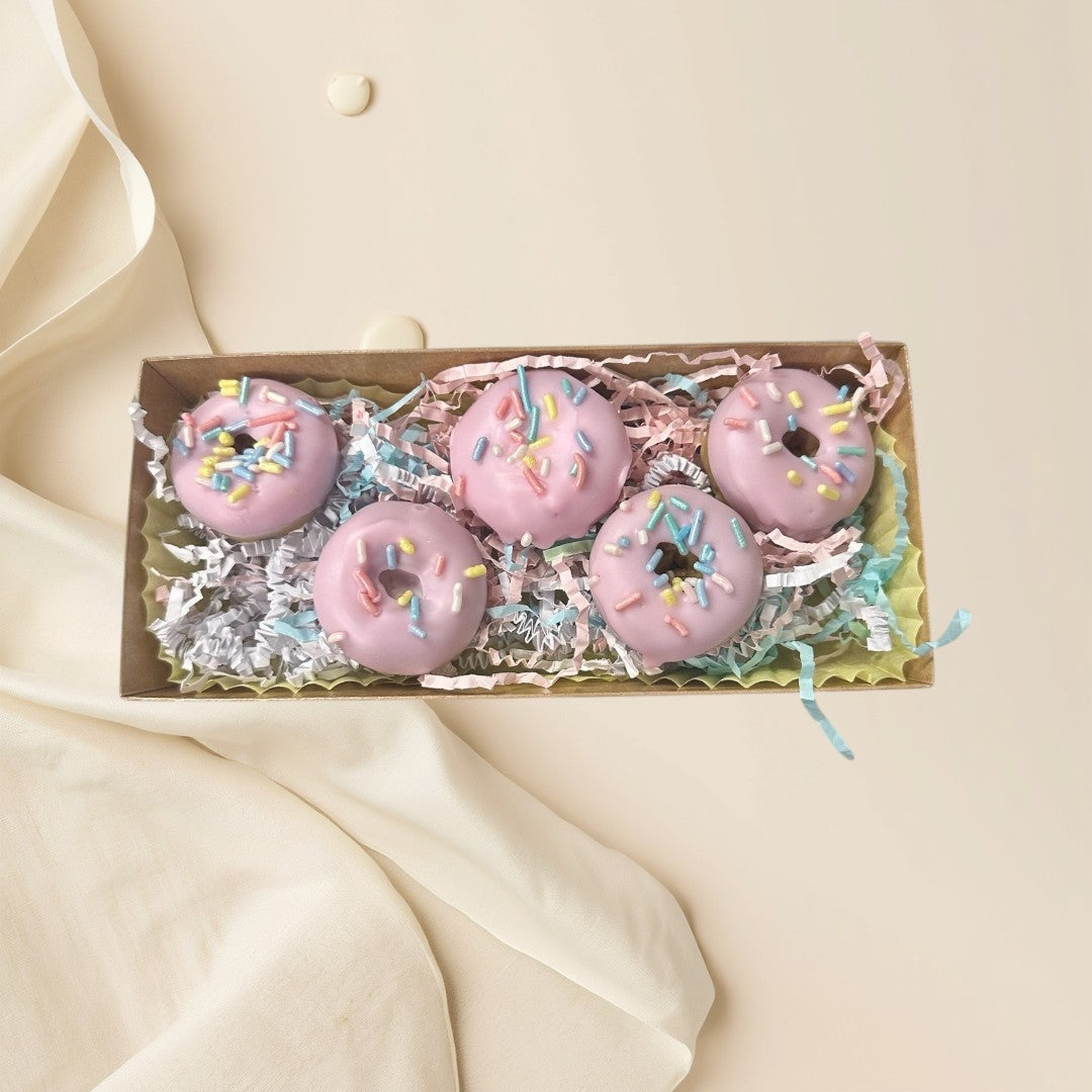 Strawberry pink strawberry glazed donut wax melts with colorful sprinkles in a gift box.