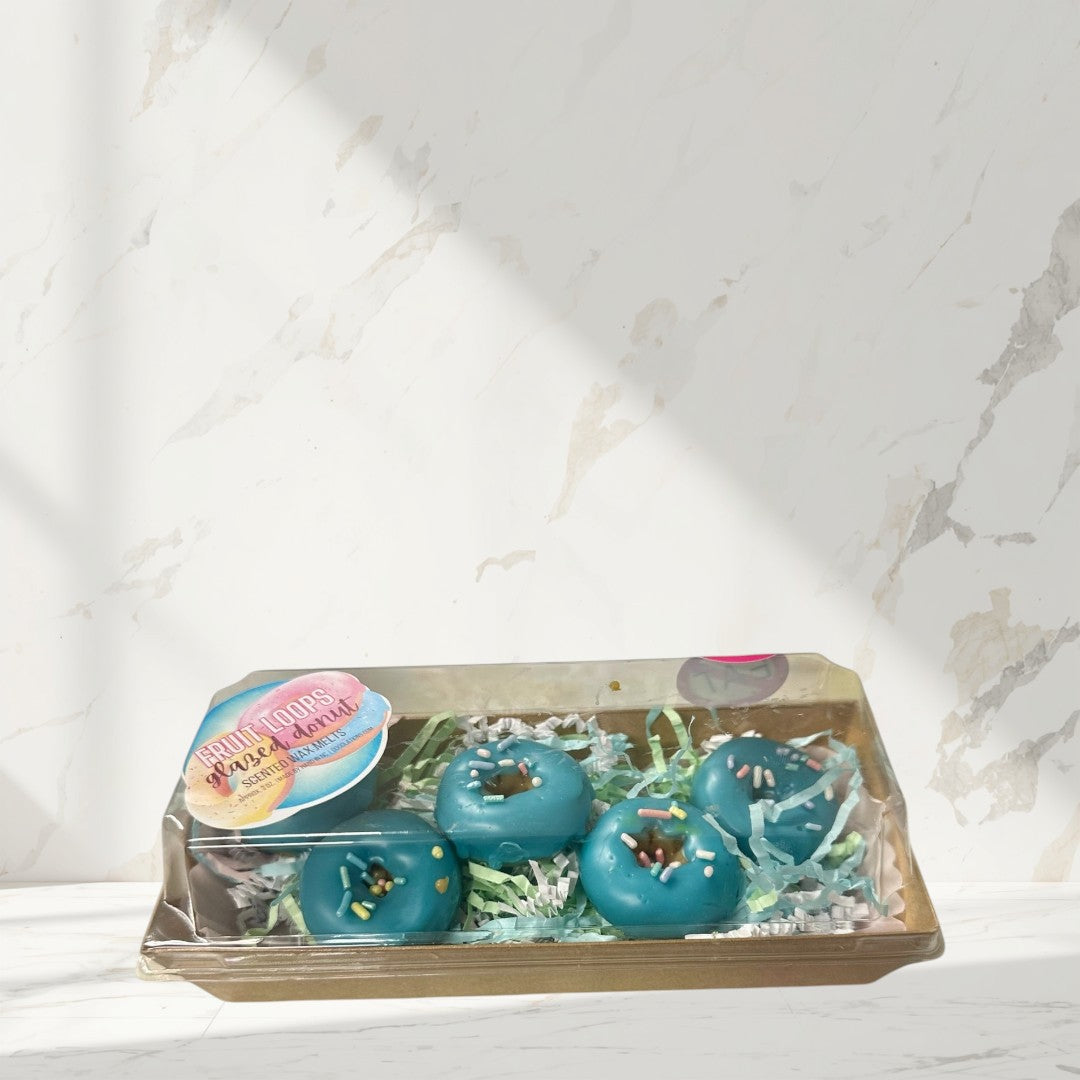 blue glazed donut wax melts with colorful sprinkles in a gift box.