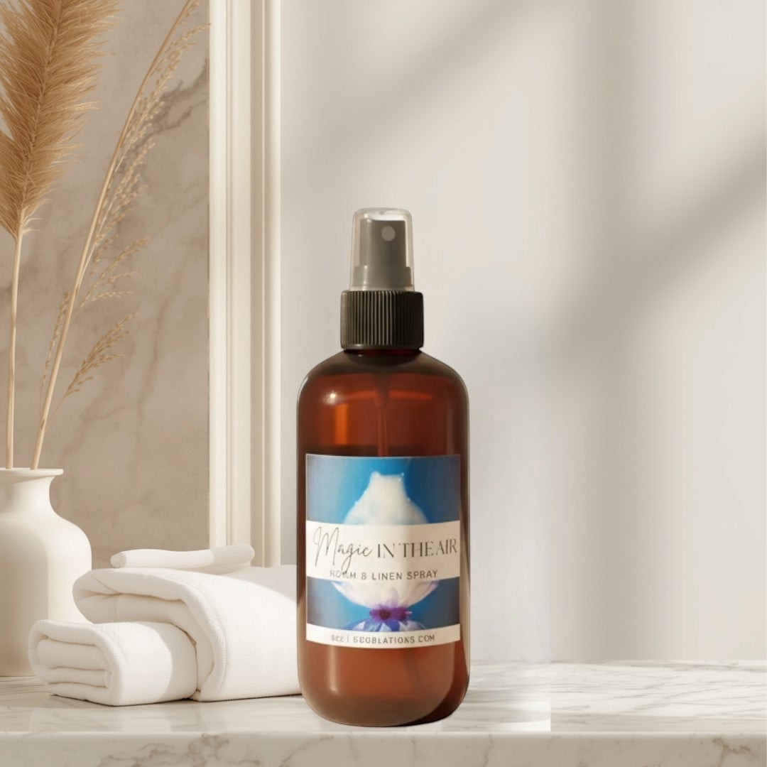 Magic in the Air Room & Linen Spray in amber bottle with blue label. Green citrusy scent.