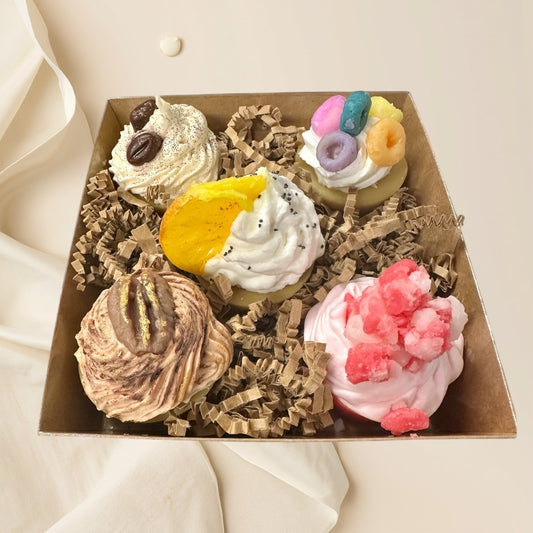 assorted mini cupcake wax melts in five scents: coffee bean, fruit loops, orange slice, maple pecan, and strawberry.