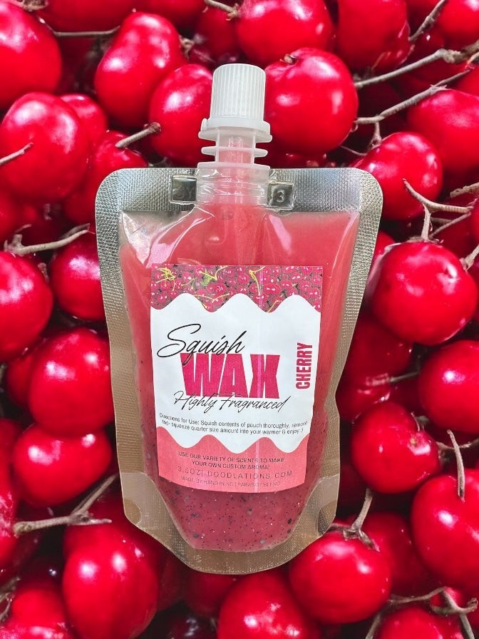 Squish Wax Melts in red, blue, and yellow pouches with glitter. Highly fragranced.