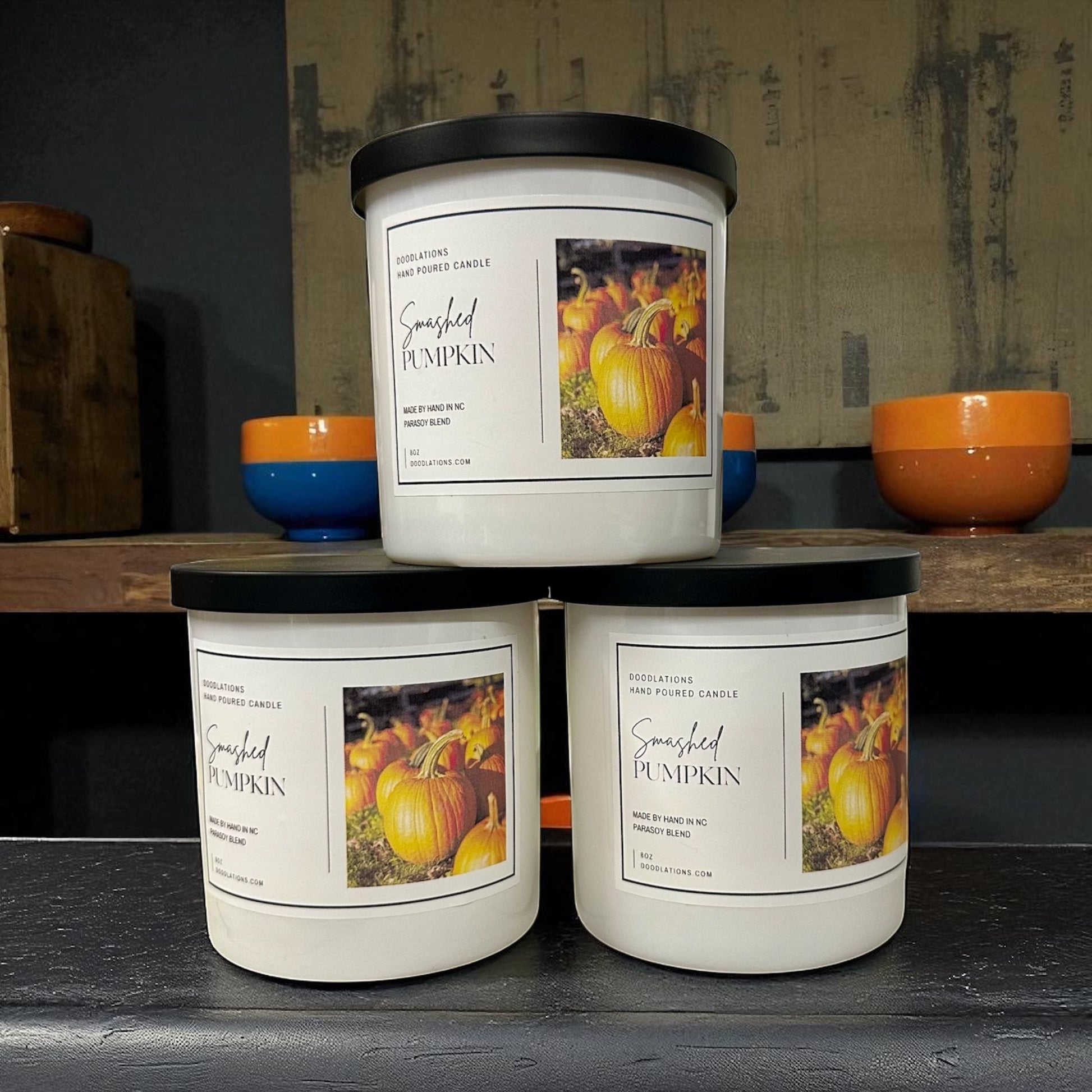 Smashed Pumpkin hand-poured soy blend candle with a dark green lid.
