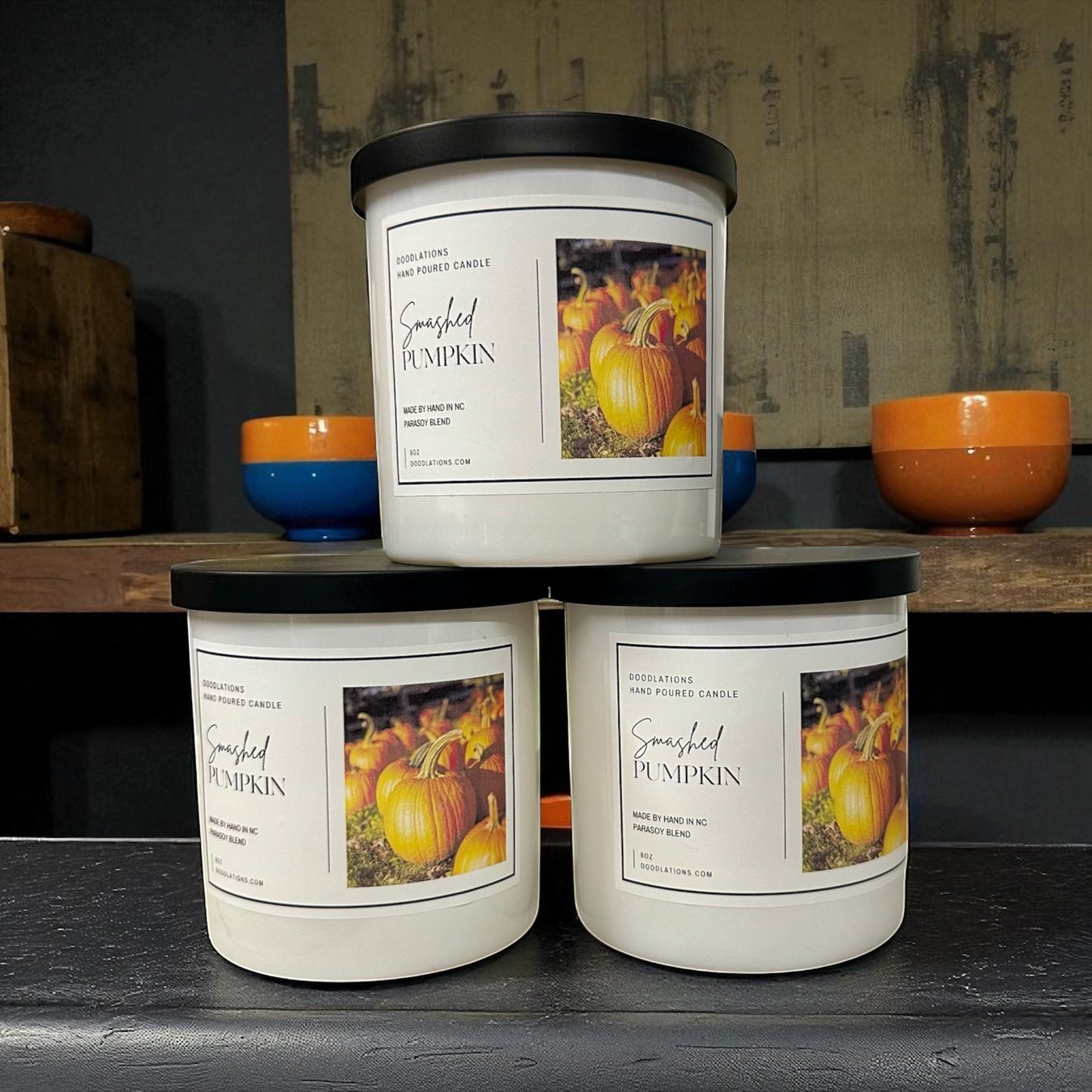 Smashed Pumpkin hand-poured soy blend candle with a dark green lid.