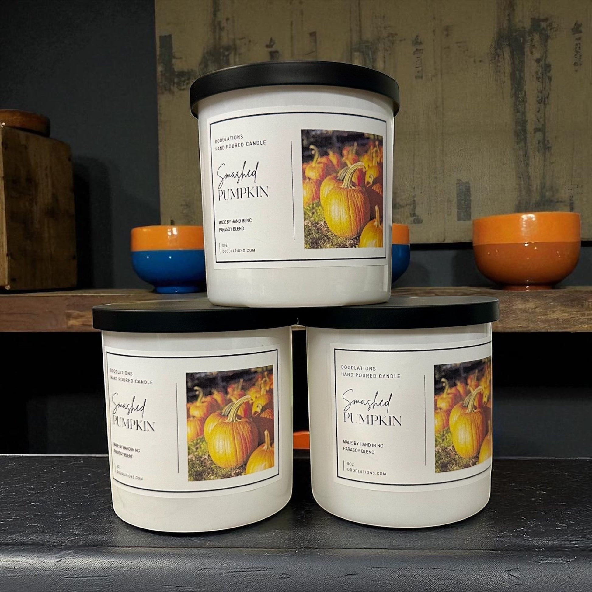 Smashed Pumpkin hand-poured soy blend candle with a dark green lid.