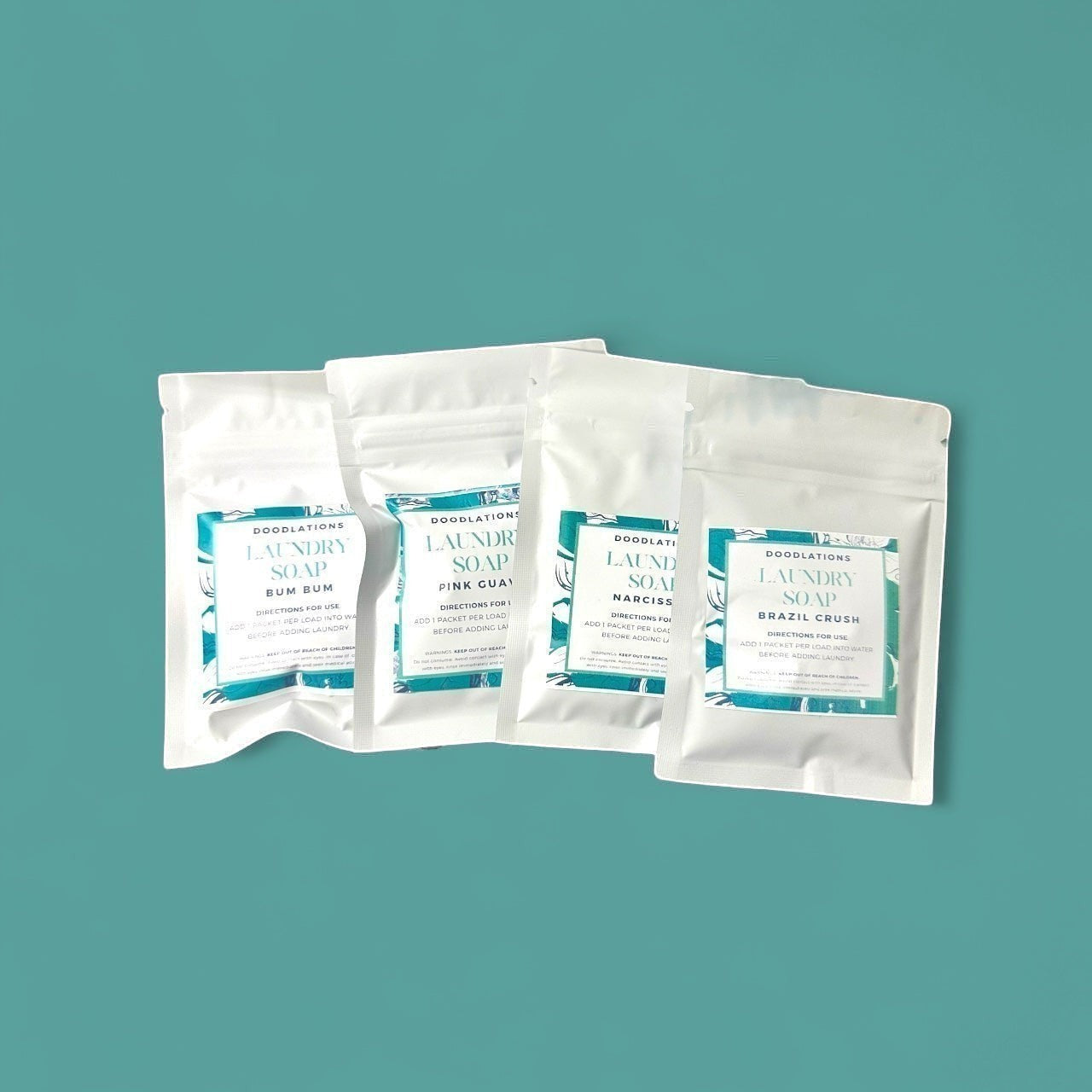 Doodlations Laundry Soap Sampler Pack with 4 different scents. Includes 4 loads of laundry.