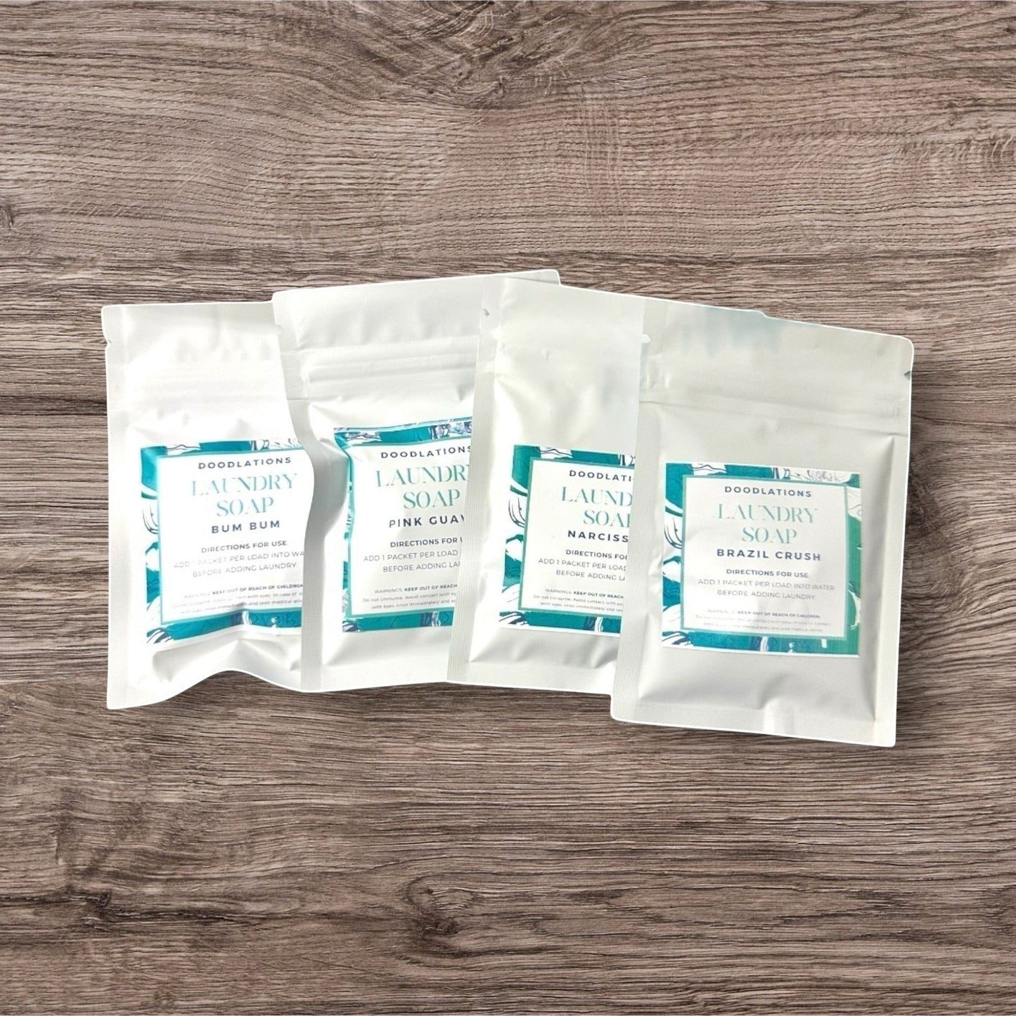 Doodlations Laundry Soap Sampler Pack with 4 different scents. Includes 4 loads of laundry.