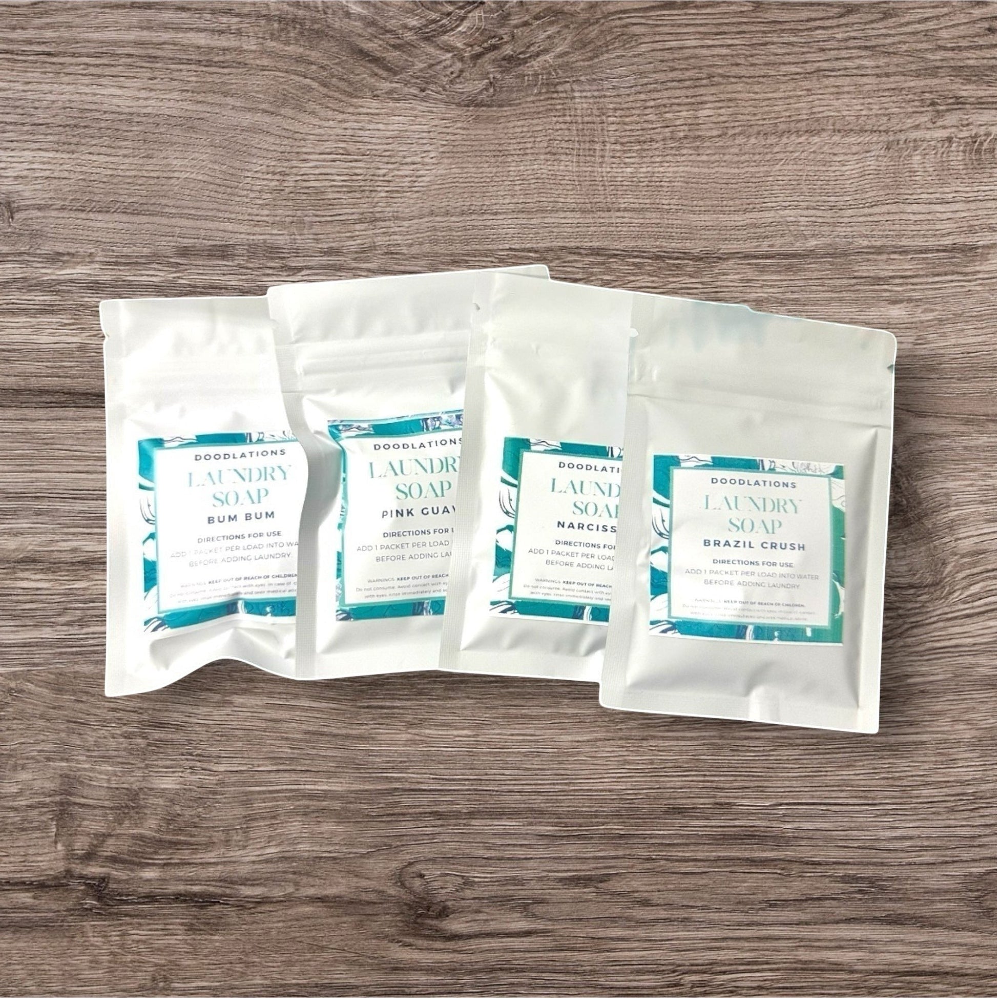 Doodlations Laundry Soap Sampler Pack with 4 different scents. Includes 4 loads of laundry.