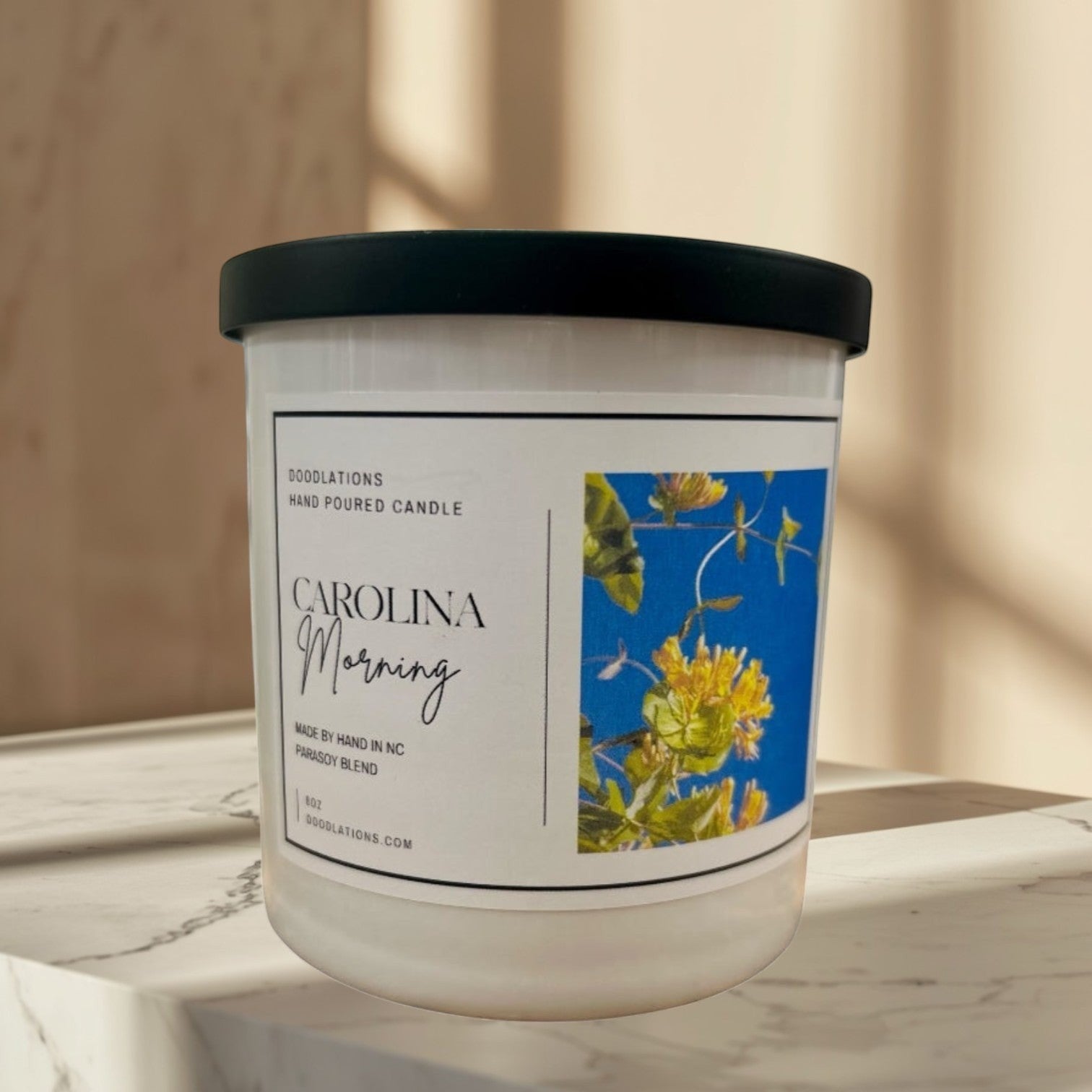 Carolina Morning hand-poured soy blend candle with floral label.