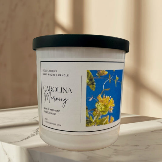 Carolina Morning hand-poured soy blend candle with floral label.