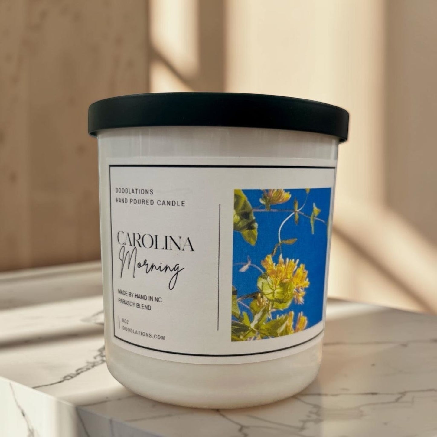 Carolina Morning hand-poured soy blend candle with floral label.