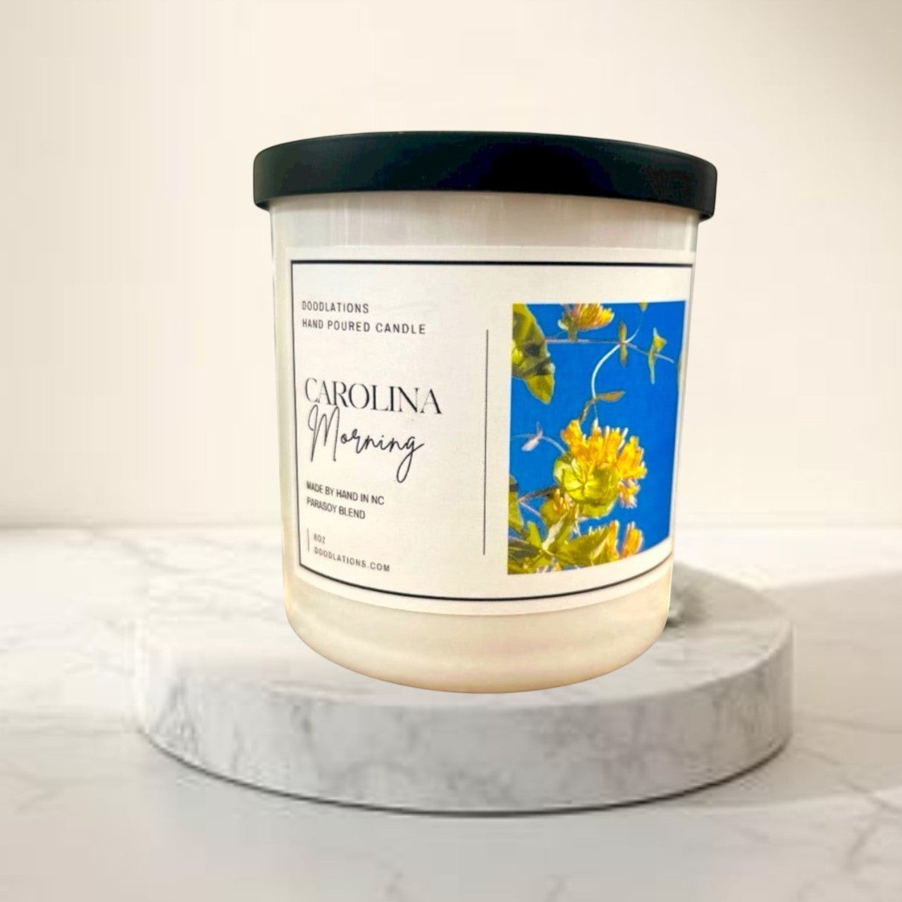 Carolina Morning hand-poured soy blend candle with floral label.