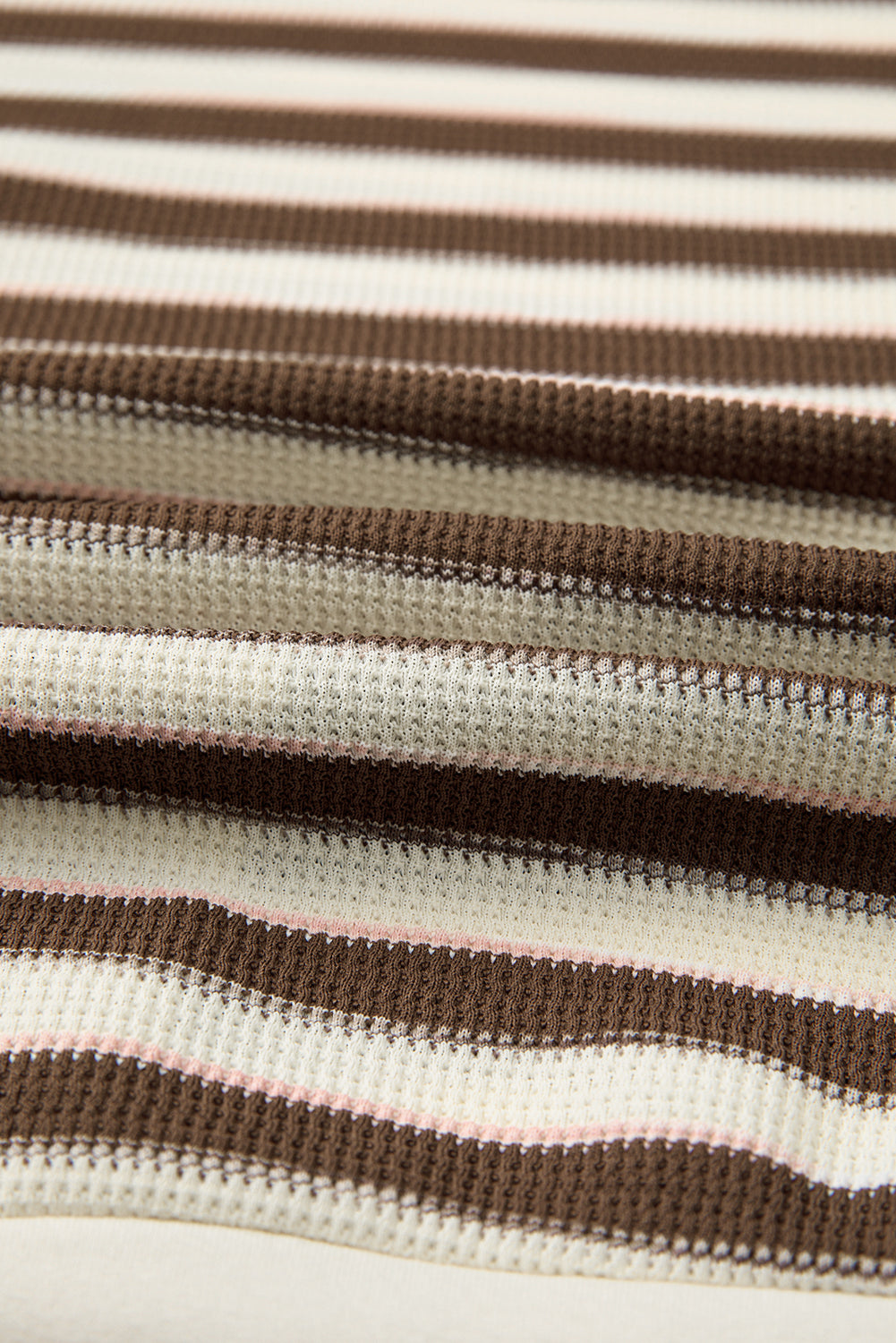 Close-up of striped fabric with brown and beige pattern