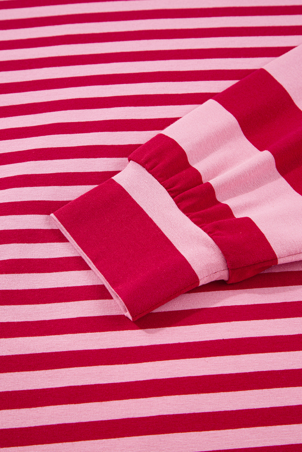 Close-up of red and white striped fabric with a folded section.