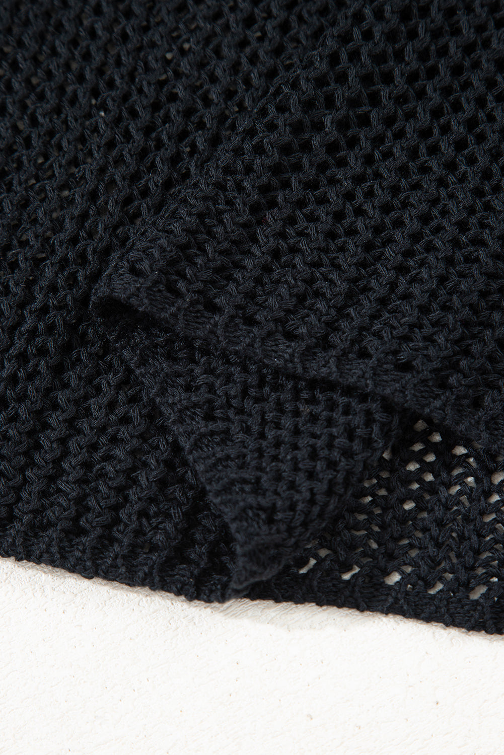 Close-up of black textured fabric on a white background