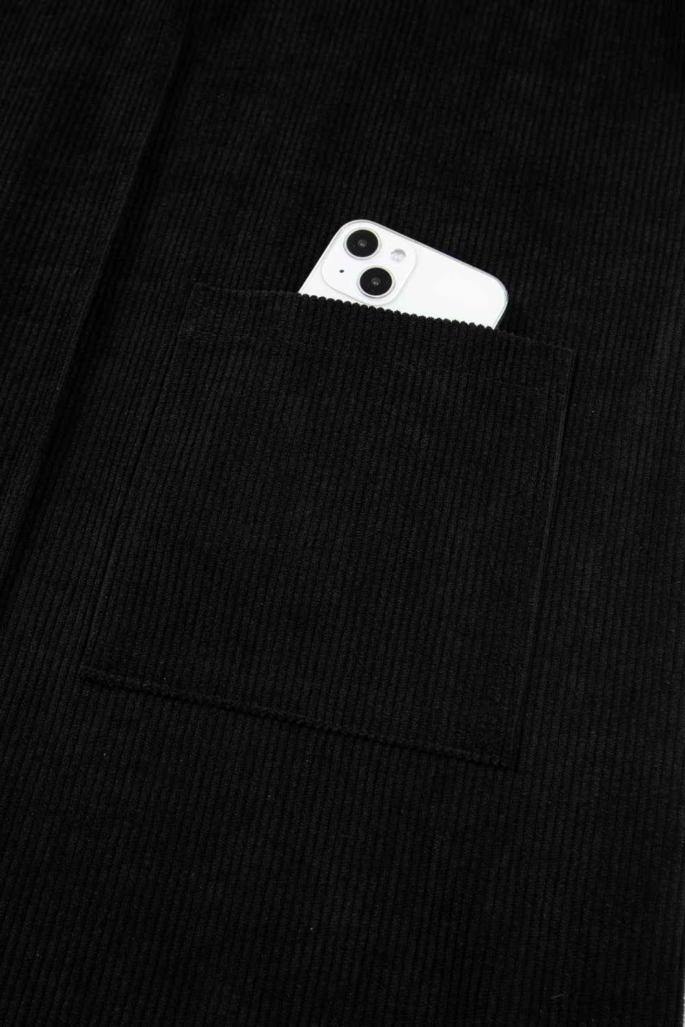 Black jacket with a white phone case in the pocket