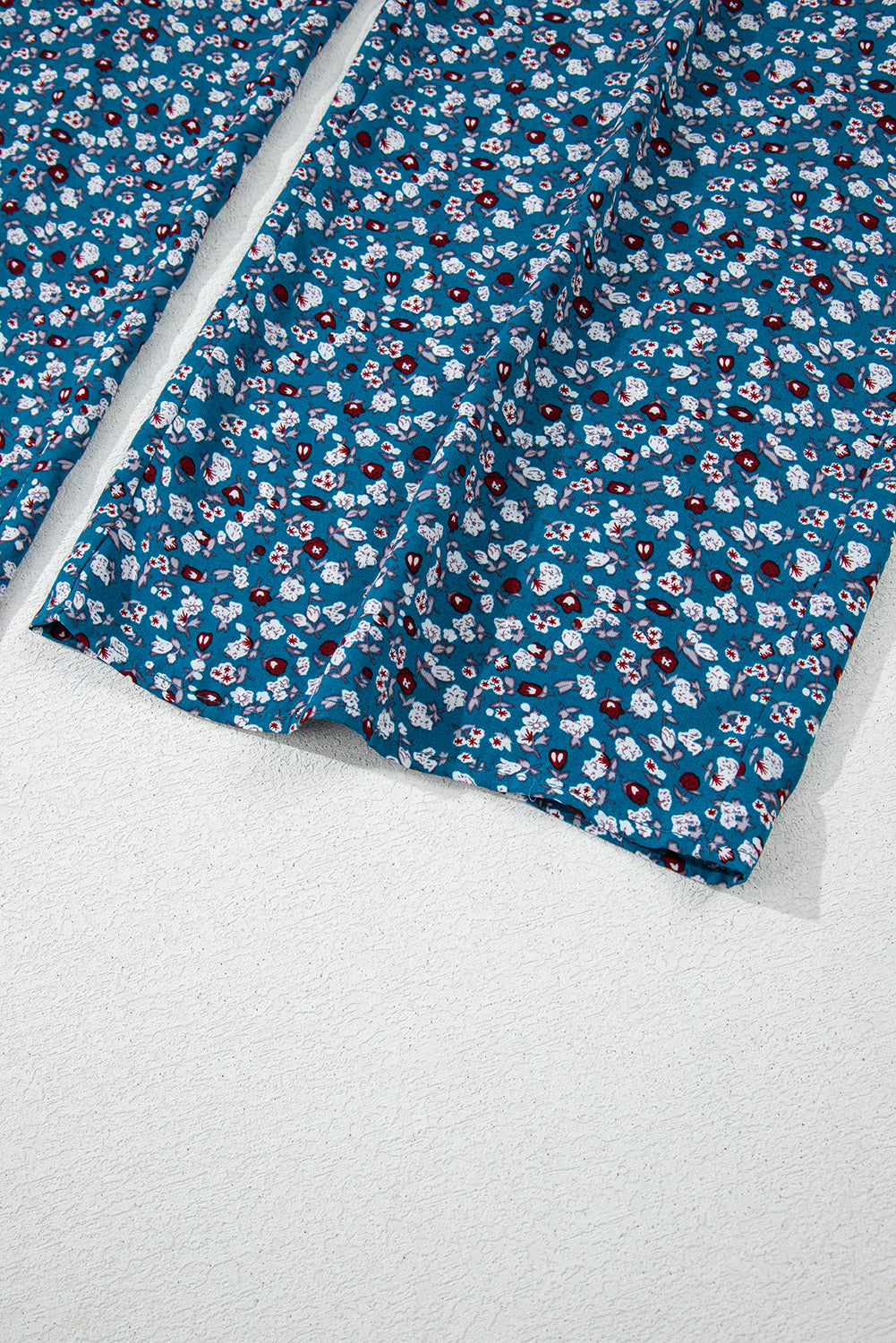 Blue floral fabric on a white background